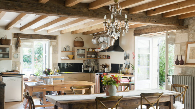 Kitchen with exposed wooden beams on the ceiling