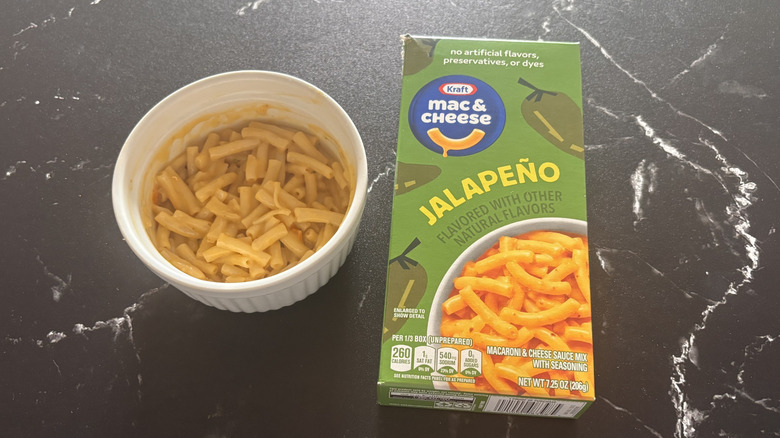 Kraft jalapeño mac and cheese box next to bowl of mac and cheese