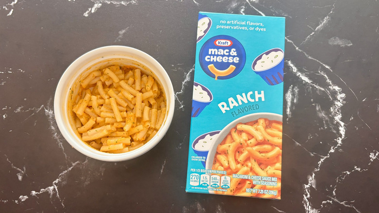 Kraft ranch mac and cheese box next to bowl of mac and cheese