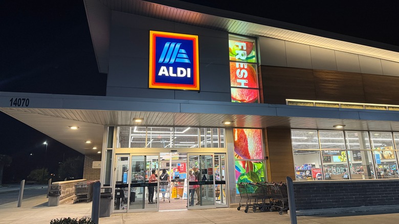 Busy Aldi location at night outside store