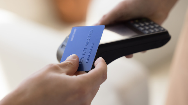 Close up view of paying with credit card