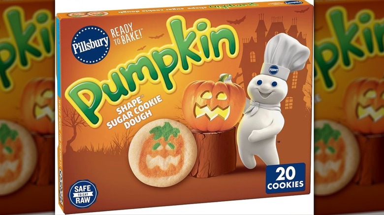 A package of Pillsbury Ready to Bake! Pumpkin Shape Sugar Cookie Dough against a white backdrop