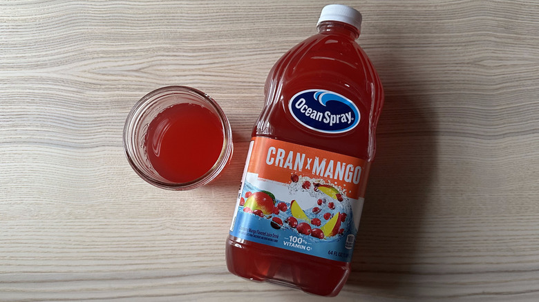 Ocean Spray Cran x Mango juice on wooden table