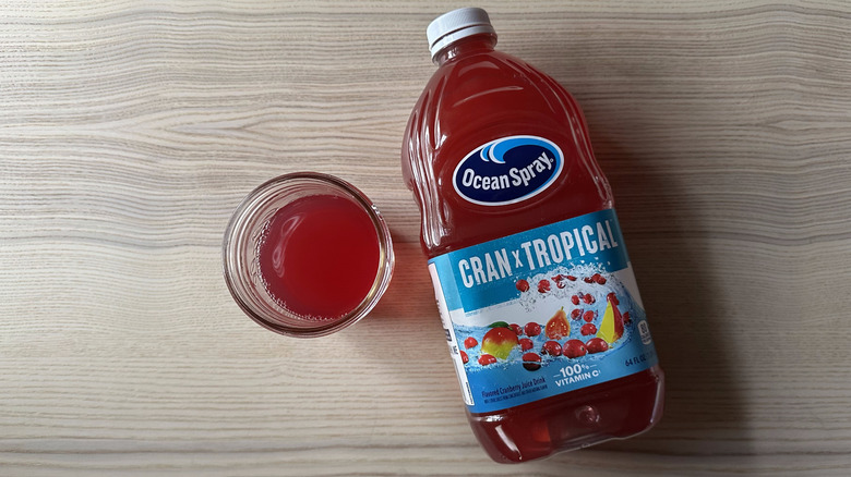 Ocean Spray Cran x Tropical juice on wooden table