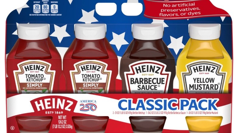 Bottles of Heinz condiments on a white surface