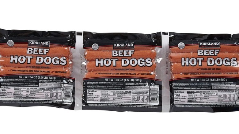 Beef hot dogs on a white surface