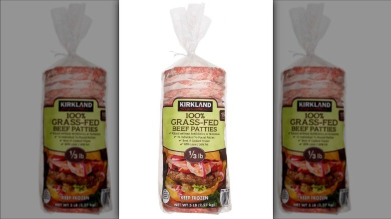 Grass-fed beef patties on white background