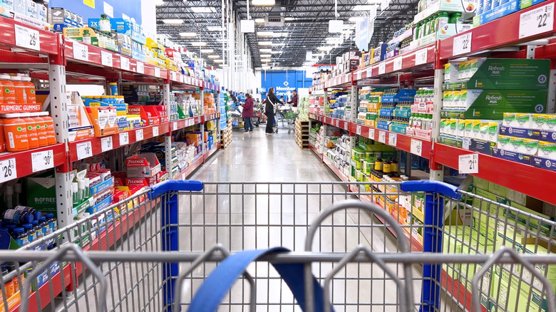 A shopping cart in an aisle at Sam's Club