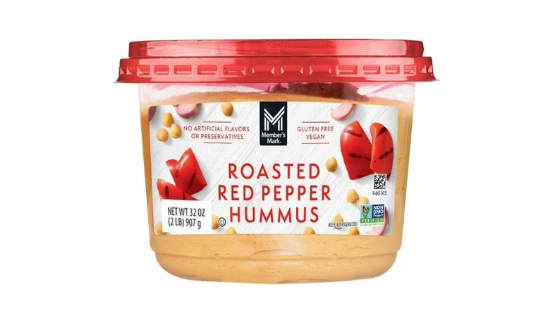 A container of Member's Mark Roasted Red Pepper Hummus on a white background