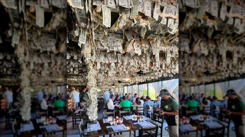 inside of the Cabbage Key restaurant with dollar bills hanging from celing