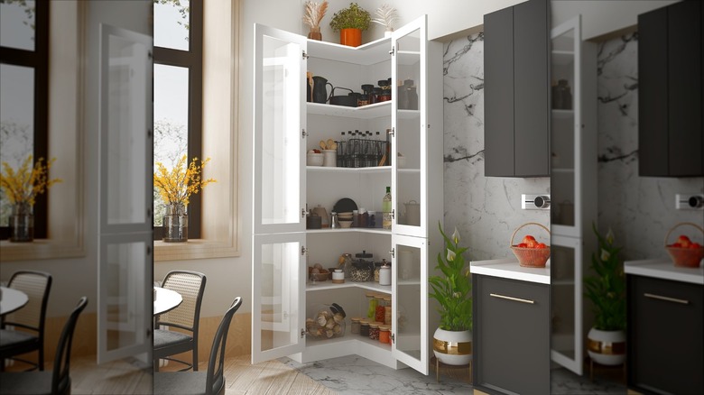 A white corner cabinet in a kitchen