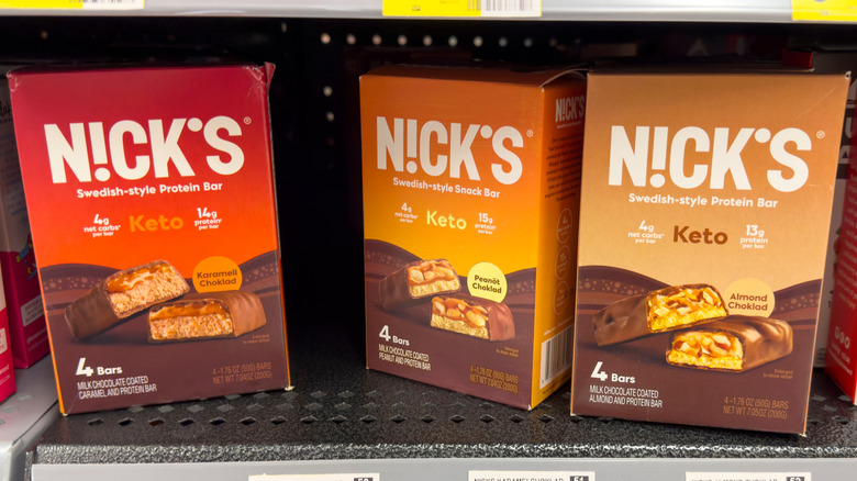 Boxes of Nick's protein bars on a grocery store shelf
