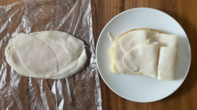 Low sodium turkey on a plastic sheet and an open sandwich