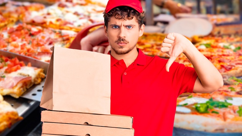Pizza shop worker thumbs down