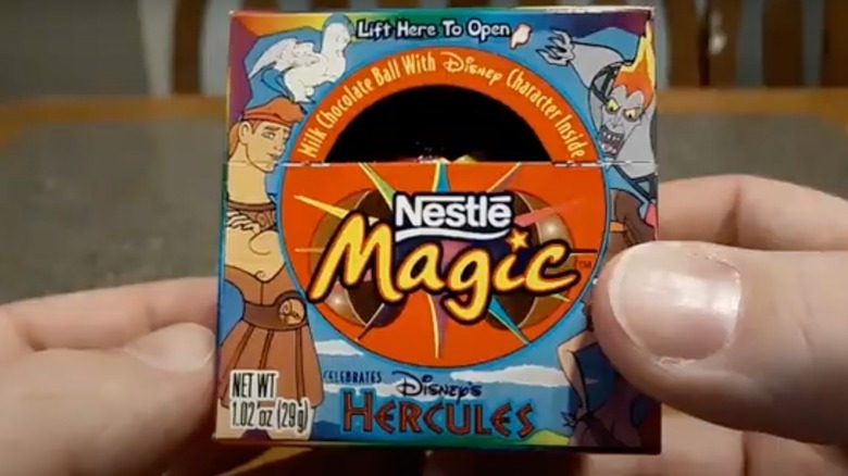 Hands holding up Magic Ball candy box