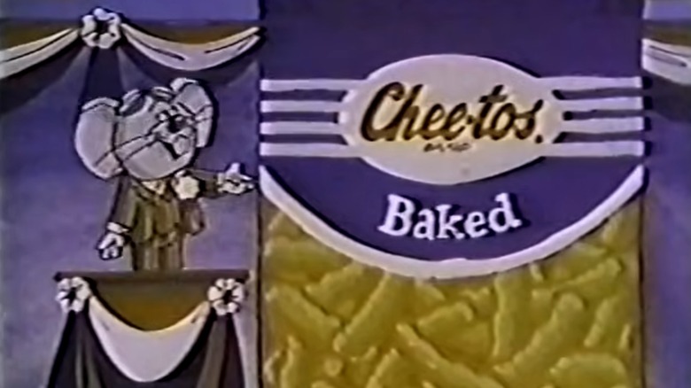 Cartoon Cheetos mouse on stage with bag of Cheetos