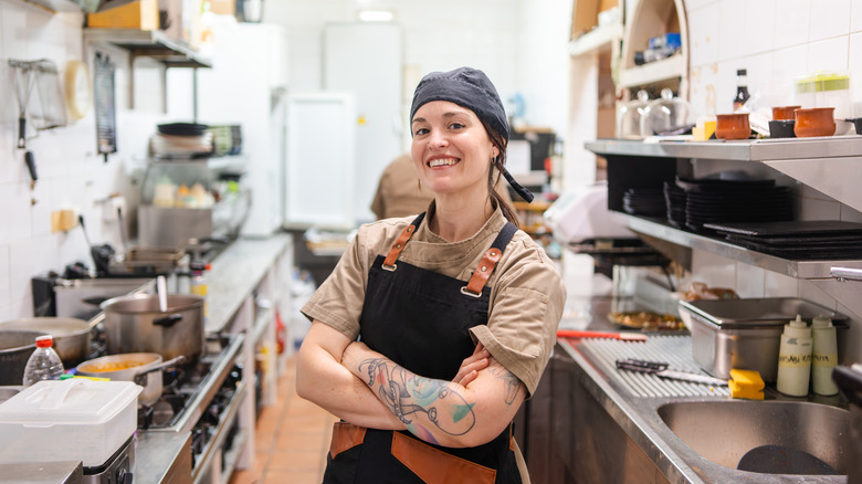 Proud, confident chef in her kitchen