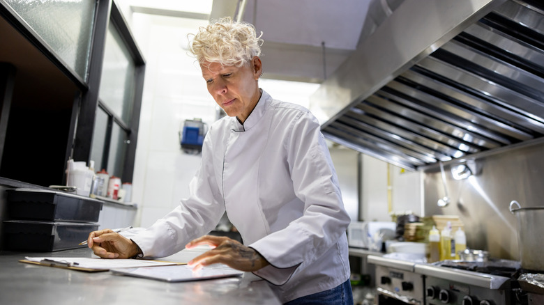 Chef organizing and planning in the kitchen
