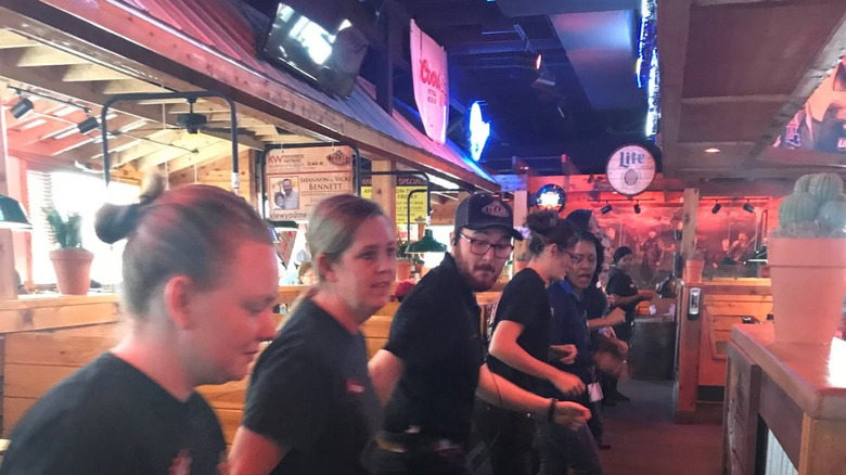 Texas Roadhouse employees practice line dancing