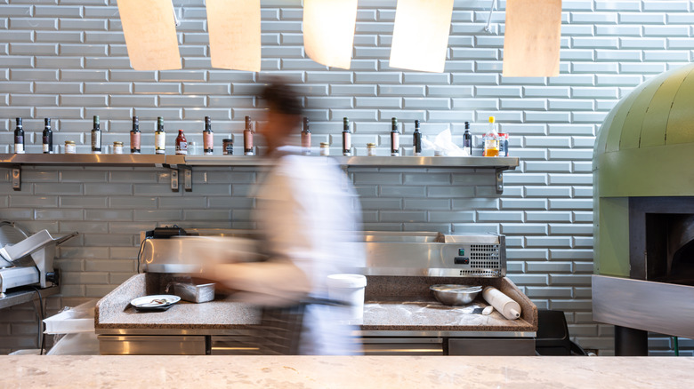 Busy chef in restaurant during service rush hour