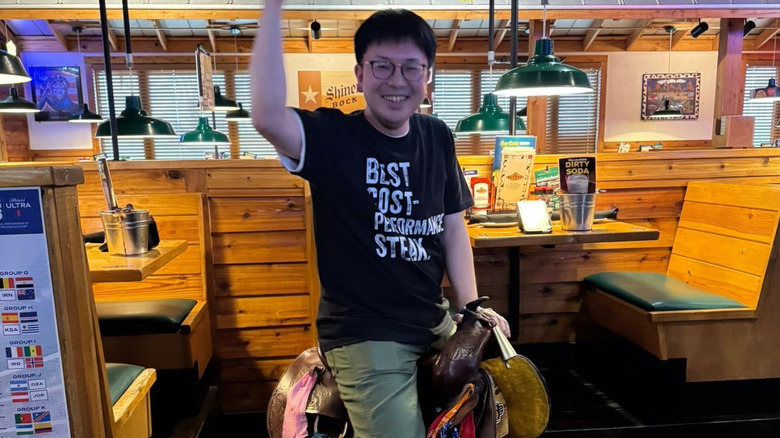 Trying out the birthday saddle at Texas Roadhouse