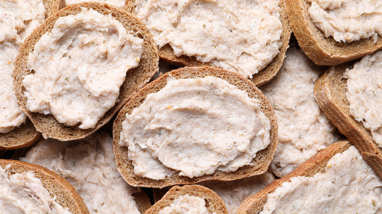 Pieces of bread spread with lard