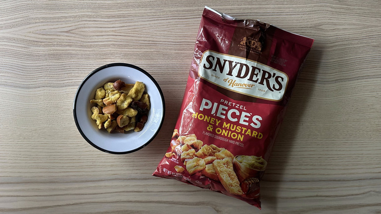 Snyder's Honey Mustard and Onion Pretzel Pieces on wooden table