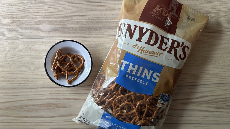 Snyder's Thins Pretzels on wooden table