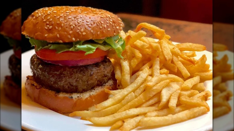 Burger and fries at Balthazar on a white plate