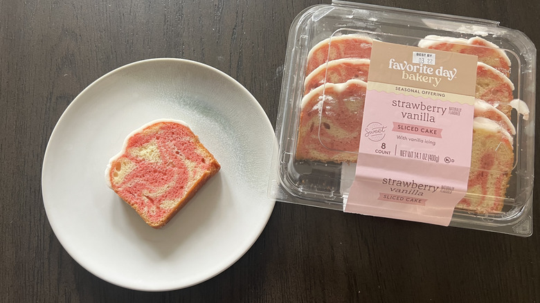 Favorite Day Bakery Strawberry Vanilla Sliced Cake with Vanilla Icing on a plate.