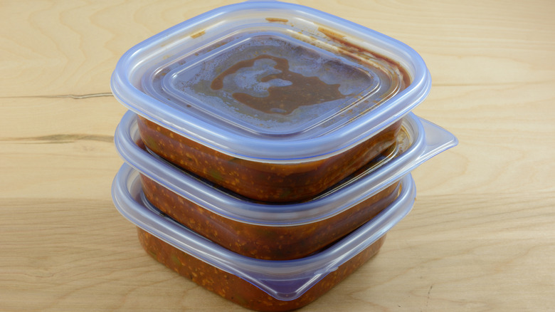 Bolognese pasta sauce in Tupperware containers