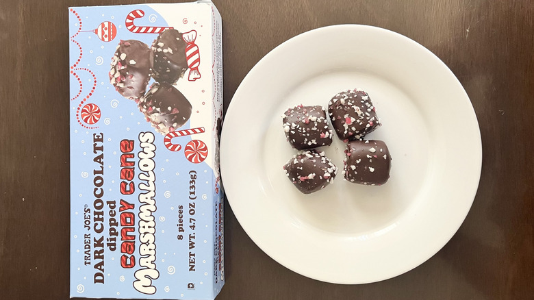 Dark Chocolate Dipped Candy Cane Marshmallows on a plate and a box of Trader Joe's marshmallows next to it
