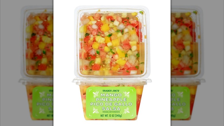 Plastic tub of Trader Joe's Mango Pineapple Pico de Gallo Salsa