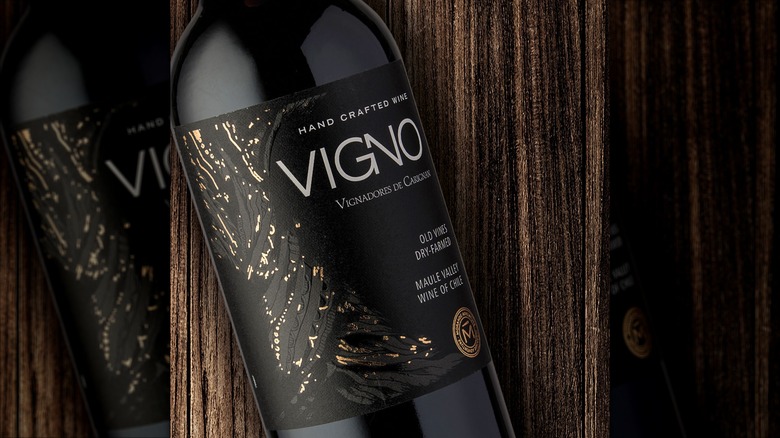 Closeup of VIGNO Carignan Maule bottle on wooden surface