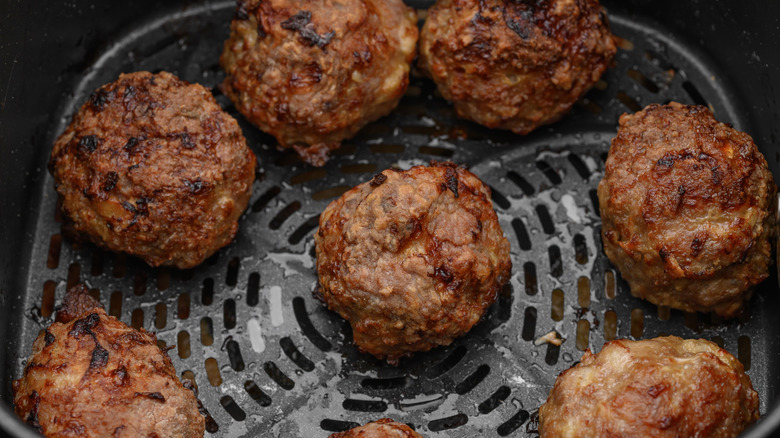 Meatballs in the basket of an air fryer