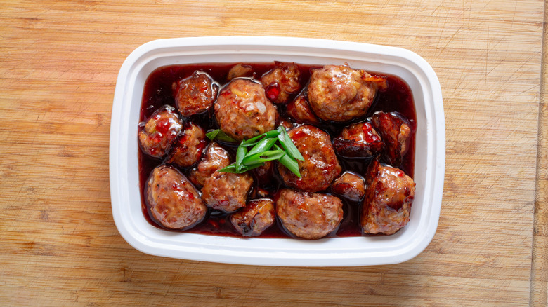Grape jelly meatballs in rectangular white dish