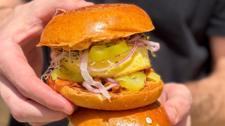 Hand holding Breakfast in Bombay sandwich
