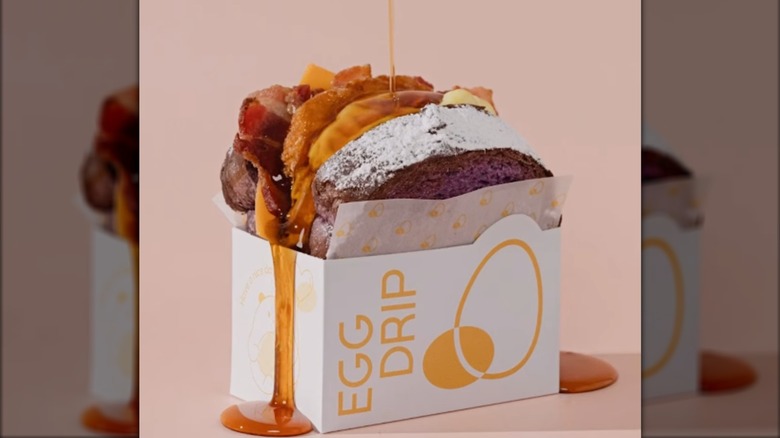 Syrup dripping onto an Ubé-Bee sandwich