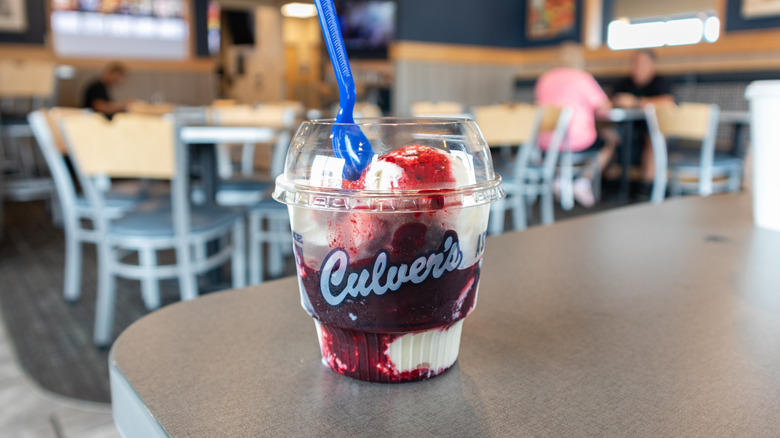 A frozen dessert with strawberry sauce