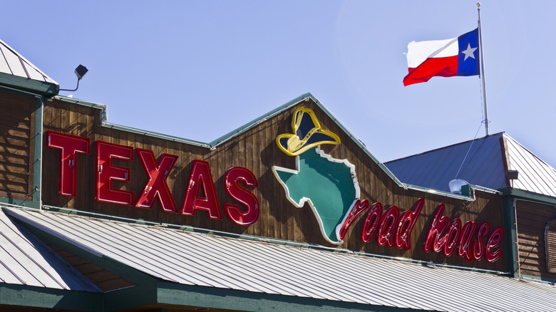 Texas Roadhouse exterior with a Texan flag flying above it