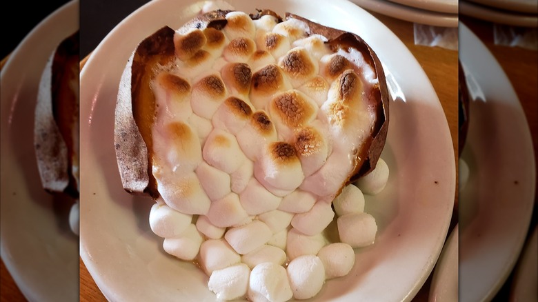 Sweet baked potato with cooked marshmallows on top from Texas Roadhouse