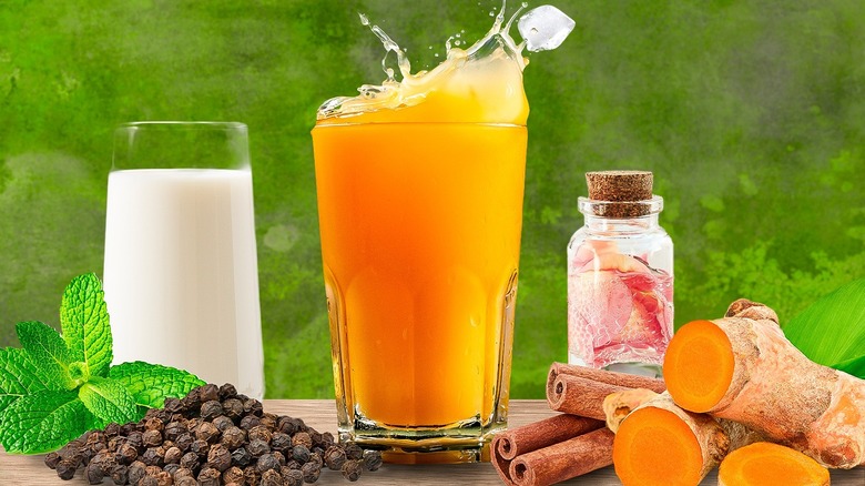 Glass of juice surrounded by flavours