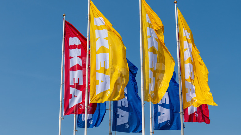 Ikea flags against blue sky background.