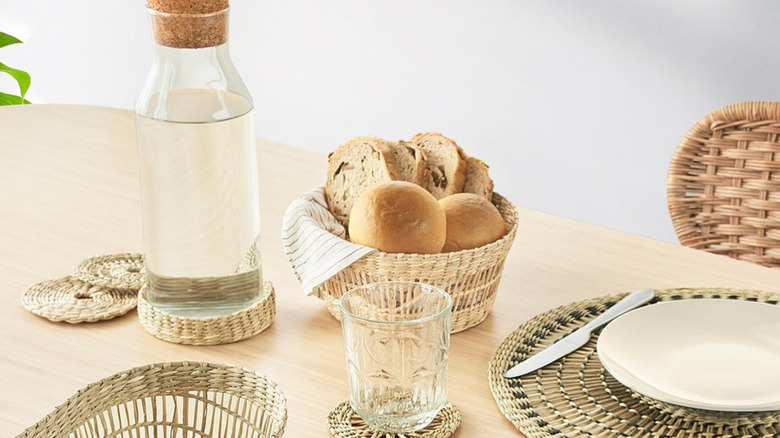 The Pennfisk basket holding bread on a laid table.
