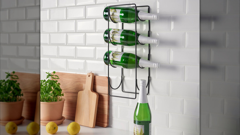 Ikea's Snospira four-bottle wine rack mounted on a kitchen wall.
