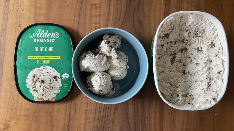 Mint chocolate ice cream in a bowl and in a container