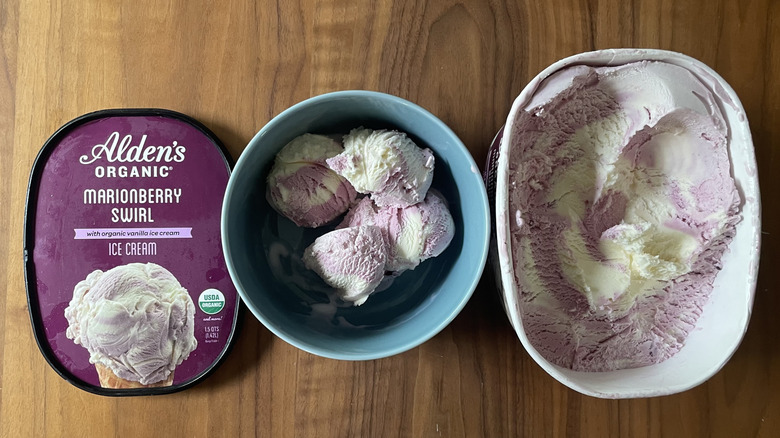 Marionberry swirl ice cream in a bowl and in a container
