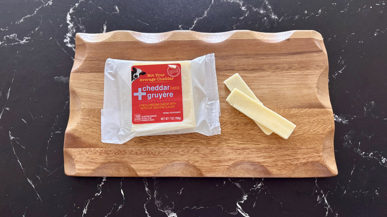 Aldi cheddar Gruyere cheese on wooden board