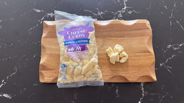 Aldi garlic cheddar cheese curds on wooden board