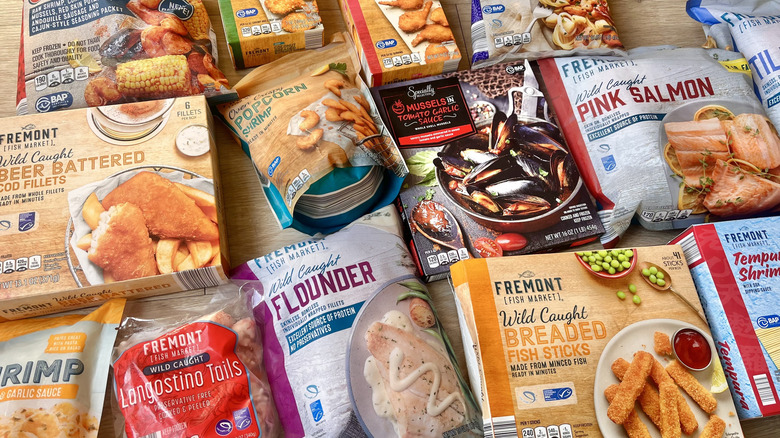 Several Aldi frozen seafood items on wood